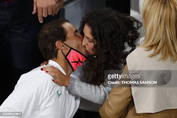 Spain's Rafael Nadal kisses his wife Maria Francisca Perello after winning against Serbia's Novak Djokovic during the men's final tennis match at the...