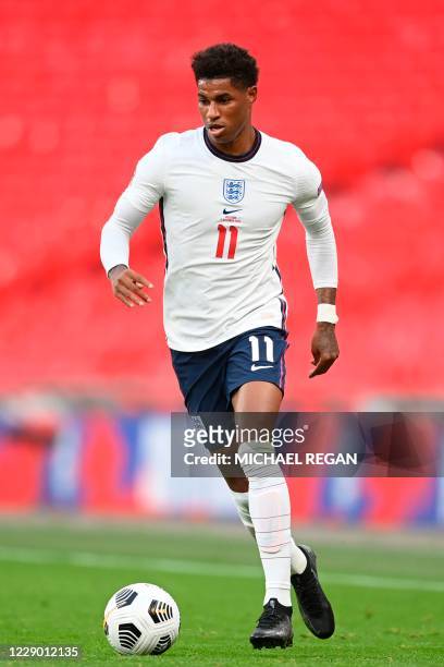 England's striker Marcus Rashford runs with the ball during the UEFA Nations League group A2 football match between England and Belgium at Wembley...