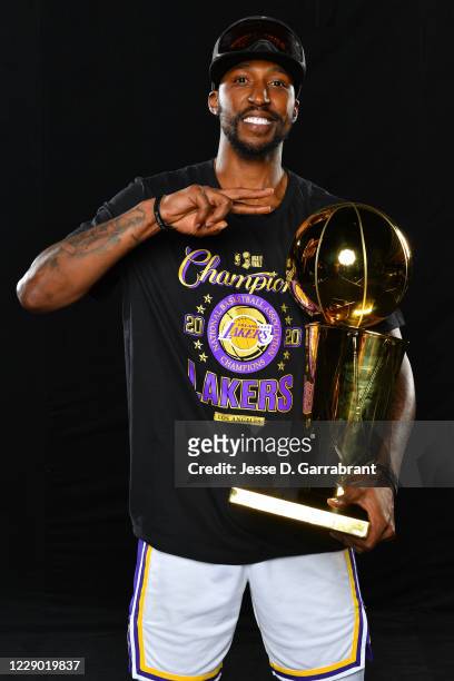 Kentavious Caldwell-Pope of the Los Angeles Lakers poses for a photo with the Larry O'Brien Trophy after winning Game Six of the NBA Finals against...