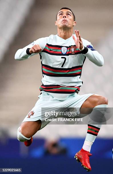 Portugal's forward Cristiano Ronaldo jumps during the Nations League football match between France and Portugal, on October 11, 2020 at the Stade de...