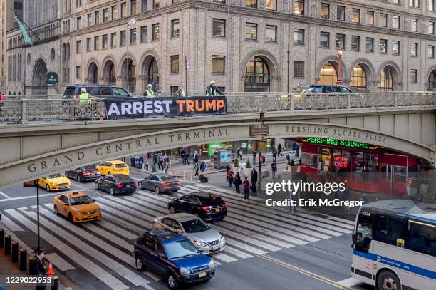 In protest of Trumps State of the Union speech on February 5 activists displayed 'ARREST TRUMP' banners inside and outside of Grand Central Terminal...