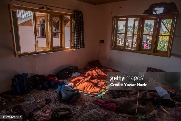 Household goods lie scattered in a residential house destroyed in a gun battle between Indian government forces and militants on October 12, 2020 in...