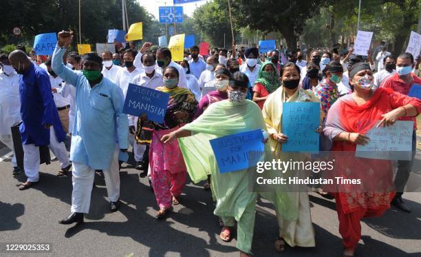 Members of Dalit community protest against the alleged gang-rape and death of a 19 year old Dalit girl in Hathras, at Sector 23-24 dividing road, on...