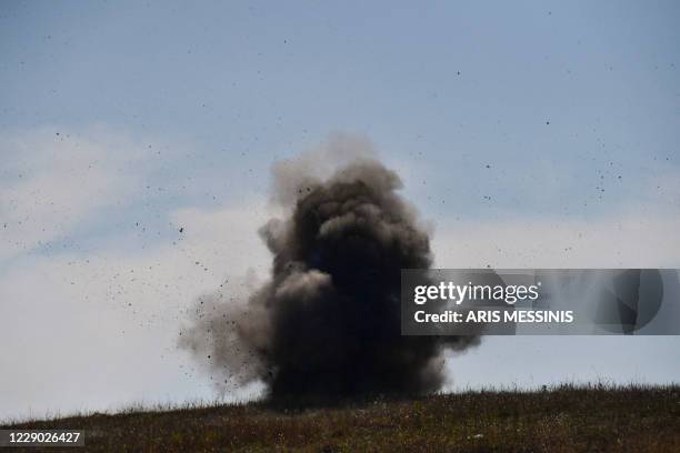 Controlled explosion of collected unexploded cluster bombs by members of a sapper group of the Karabakh Ministry of Emergency Situations on the...