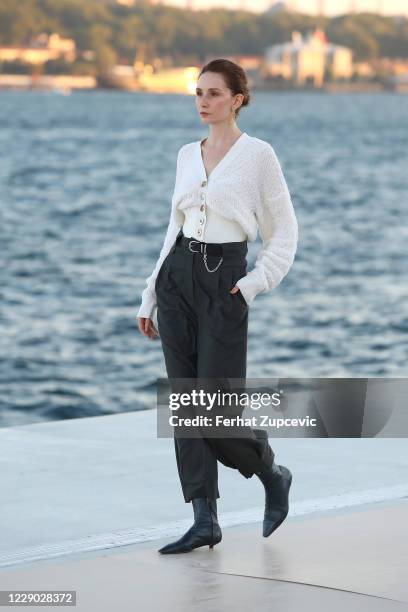 In this image released on October 12, A model walks the runway during the Natalie Kolyozyan show during Mercedes-Benz Istanbul Fashion Week at...