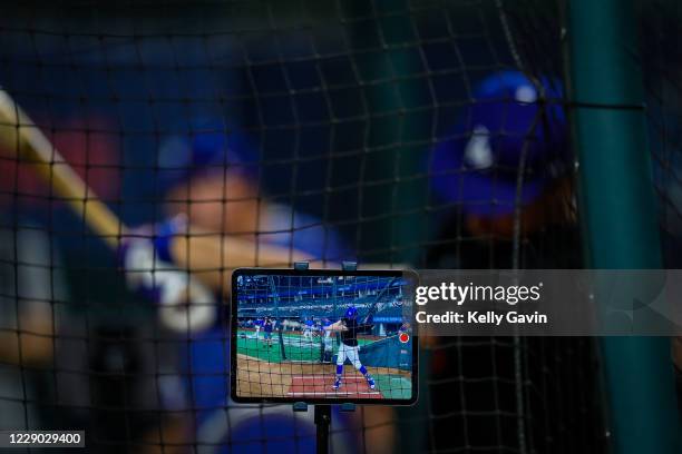 Detail shot of an iPad recording Cody Bellinger of the Los Angeles Dodgers as he takes batting practice during the workout day for the NLCS between...