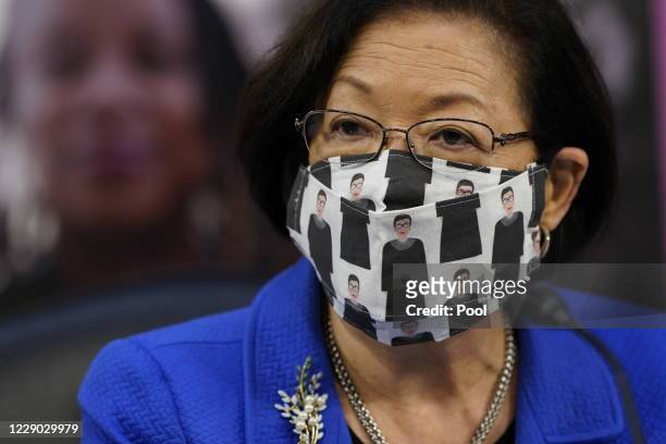 Sen. Mazie Hirono wears a Ruth Bader Ginsburg-themed face mask prior to the Supreme Court confirmation hearing for Judge Amy Coney Barrett before the...