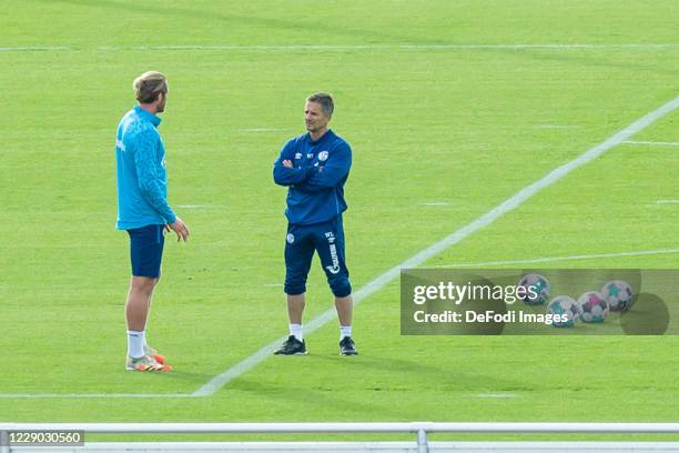 Goalkeeper Ralf Faehrmann of FC Schalke 04 and Athletic coach Werner Leuthard of FC Schalke 04 look on during the FC Schalke 04 training Session on...