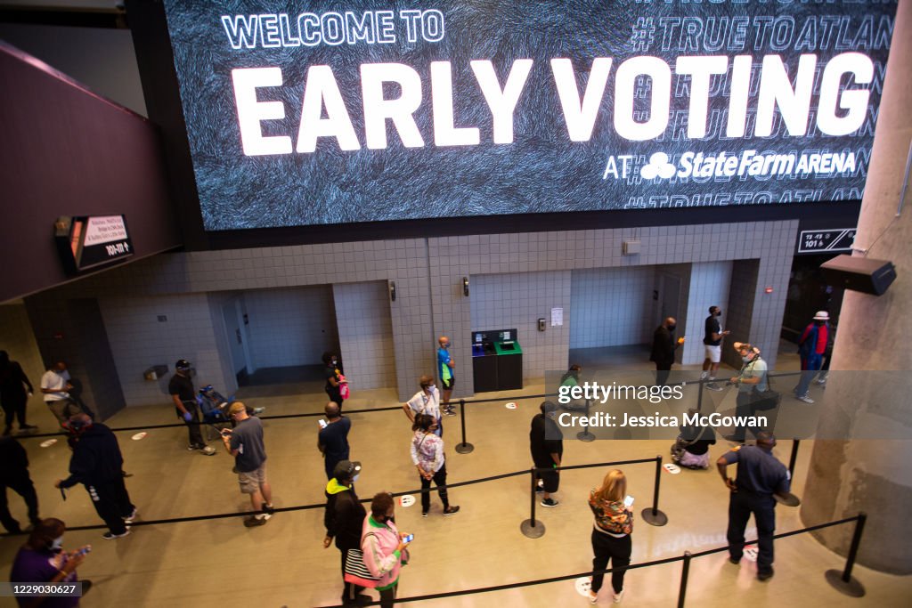 Voters line up inside of State Farm Arena, largest early