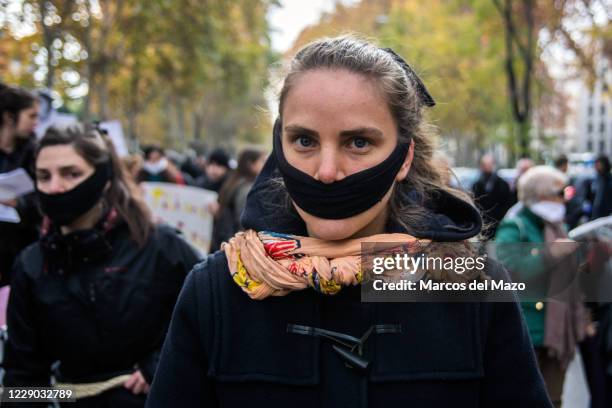 Gagged woman protesting against "Gag Law" . Social collectives have gathered in Madrid to protest against Citizen Security Law.