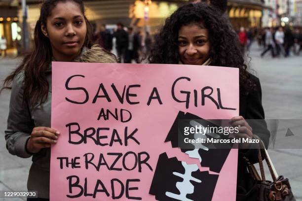Women protesting during the International Day against female genital mutilation .