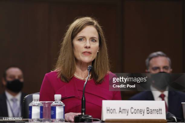 Supreme Court Justice nominee Judge Amy Coney Barrett speaks as she is sworn in during the Senate Judiciary Committee confirmation hearing for...