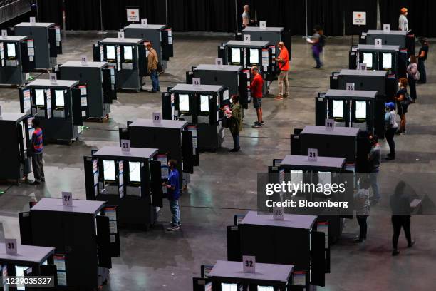 Residents cast ballots an early voting polling location for the 2020 Presidential election in Atlanta, Georgia, U.S., on Monday, Oct. 12, 2020. Early...