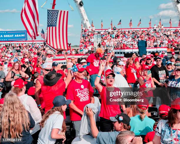 Attendees gather before a campaign rally with U.S. President Donald Trump in Sanford, Florida, U.S., on Monday, Oct. 12, 2020. Trump returns to the...