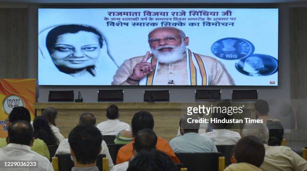 Prime Minister Narendra Modi addresses the gathering virtually during the release of a Rs. 100 commemorative coin as a part of Vijaya Raje Scindia’s...