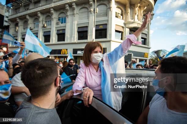 People take part in a protest against the government of Argentina's President Alberto Fernandez, in Buenos Aires, Argentina, on October 12, 2020 amid...