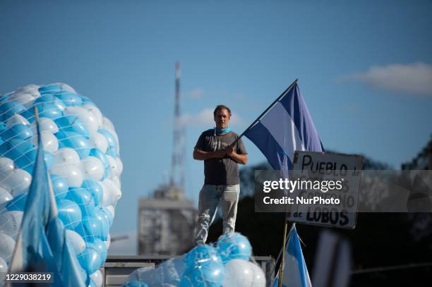 People take part in a protest against the government of Argentina's President Alberto Fernandez, in Buenos Aires, Argentina, on October 12, 2020 amid...