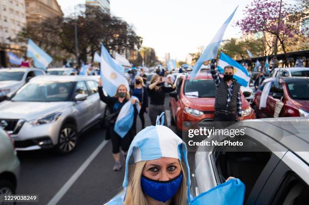 People take part in a protest against the government of Argentina's President Alberto Fernandez, in Buenos Aires, Argentina, on October 12, 2020 amid...