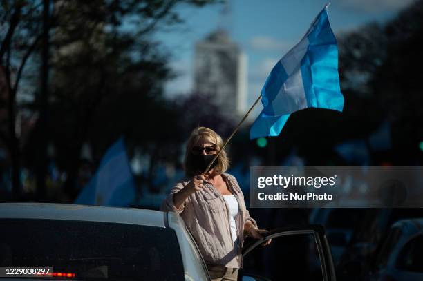 People take part in a protest against the government of Argentina's President Alberto Fernandez, in Buenos Aires, Argentina, on October 12, 2020 amid...
