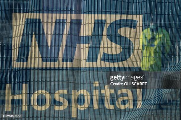 Signage is seen outside the NHS Nightingale Hospital North West field hospital, set up to provide more hospital capacity during the novel coronavirus...