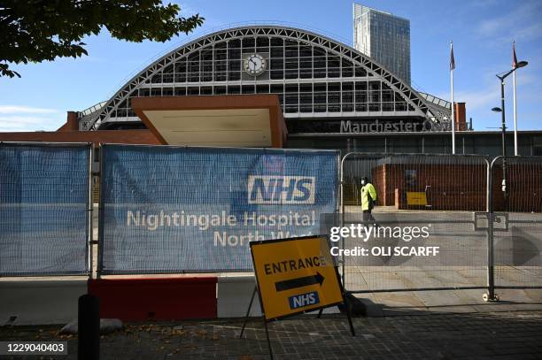 Signage is seen outside the NHS Nightingale Hospital North West set up to provide more hospital capacity during the novel coronavirus pandemic at...