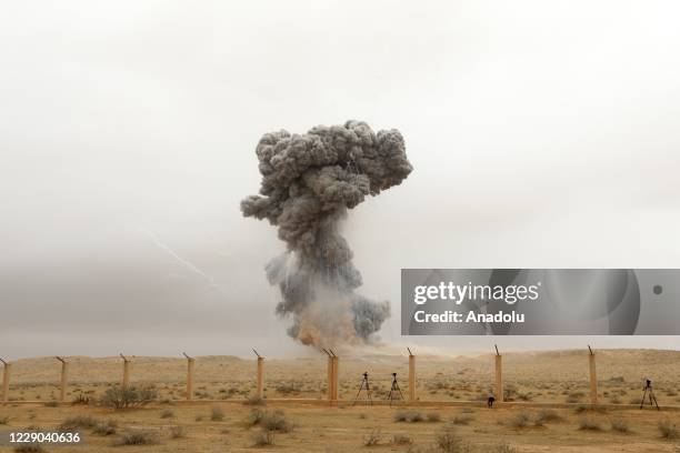 Smoke rises after Teams affiliated to the Libyan Army Military Engineering Directorate members detonated the 22 tons of ammunition cleared from...