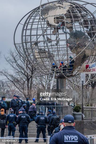 On the morning of Donald Trumps State of the Union address, January 30, 2018; a group of activist women climbed inside globe outside Trump...