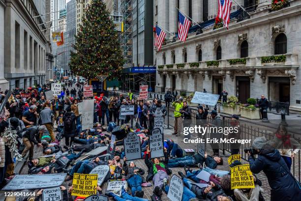 About 500 protesters chanting Kill the Bill, Dont Kill Us! filled the street outside the New York Stock Exchange on December 19, 2017; where the...