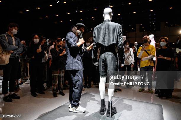 Designer Takuya Morikawa speaks about the installation presenting his creations from fashion brand TAAKK for the 2021 spring/summer collection at...