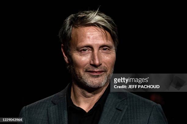 Danish actor Mads Mikkelsen arrives for the opening ceremony of the 12th edition of the Lumiere Film Festival in Lyon, central eastern France, on...