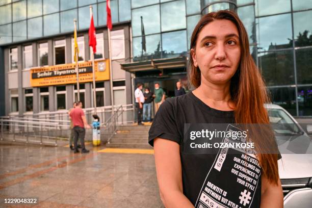 Actress Ruges Kirici answers media in front of Istanbul metropolitan municipality theater building after Turkish authorities have banned a...