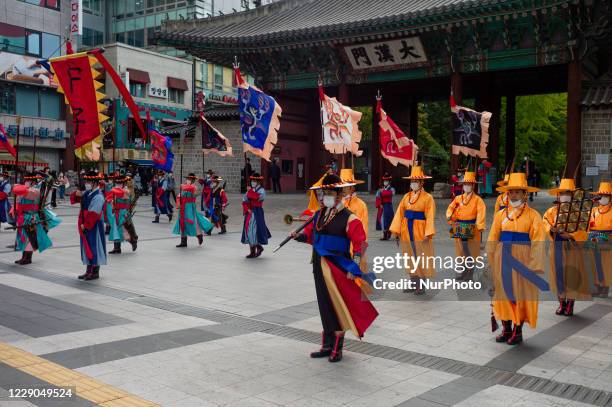 South Korean Imperial guards wearing masks as South Koreans take measures to protect themselves against the spread of coronavirus during a...