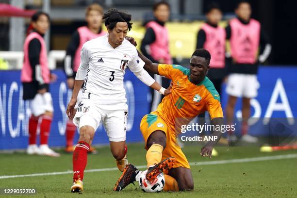 Sei Muroya of Japan, Odilon Kossounou or Ivory Coast during the friendly match between Japan and Ivory Coast at Stadium Galgenwaard on October 13,...