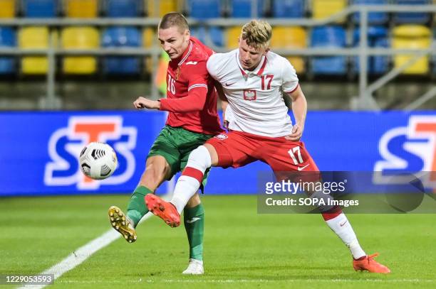 Valentin Antov of Bulgaria and Mateusz Bogusz of Poland are seen in action during football U-21 European Championships 2021 Qualifiers match between...