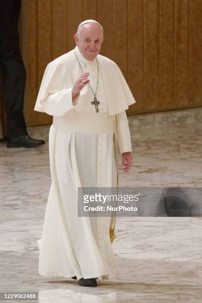 Pope Francis arrives for his weekly general audience in the Pope Paul VI hall at the Vatican, Wednesday, Oct. 14, 2020.