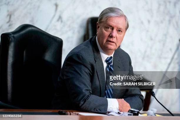 Senate Judiciary Committee Chairman Lindsey Graham questions President Donald Trumps Supreme Court nominee Judge Amy Coney Barrett during the third...