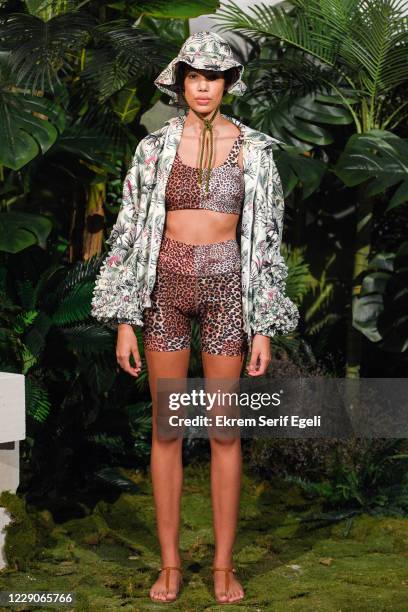 In this image released on October 14, A model poses during the Sudi Etuz presentation during Mercedes-Benz Istanbul Fashion Week at Galataport Rhtm &...