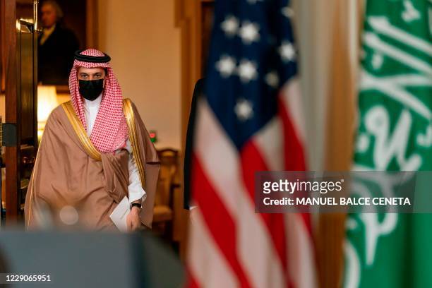 Saudi Minister of Foreign Affairs Prince Faisal bin Farhan Al Saud walks with Secretary of State Mike Pompeo, towards the Treaty Room at the State...