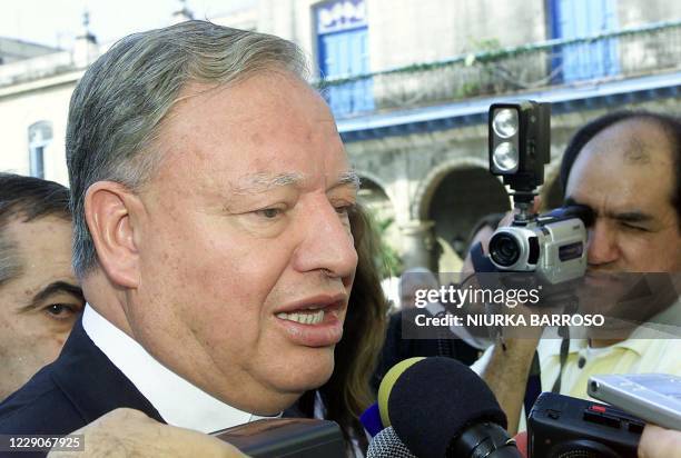 Cardinal J. Sandoval Iniguez, the archbishop of Guadalajara, Mexico, speaks to the press as he arrives at the Cathedral of Havana 08 March 2003. AFP...