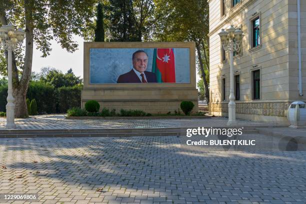 Picture taken on October 14, 2020 shows a picture of Azerbaijan's late president Heydar Aliyev in Terter city centre during the ongoing fighting...