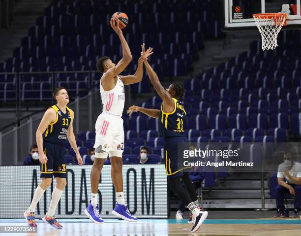 Walter Tavares, #22 of Real Madrid shoots the ball against Devin Booker, #31 of Khimki Moscow Region during the 2020/2021 Turkish Airlines EuroLeague...