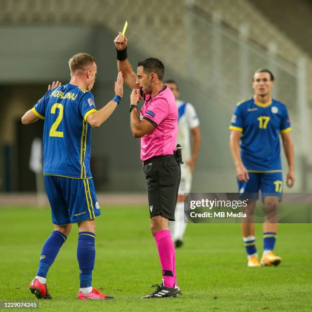 Florent Hadergjonaj of Kosovo is shown a yellow card during the UEFA Nations League group stage match between Greece and Kosovo at OACA Spyros Louis...