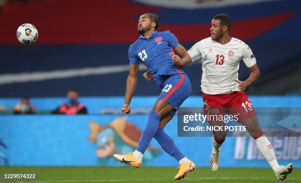 England's striker Dominic Calvert-Lewin is challenged by Denmark's defender Mathias Jorgensen during the UEFA Nations League group A2 football match...
