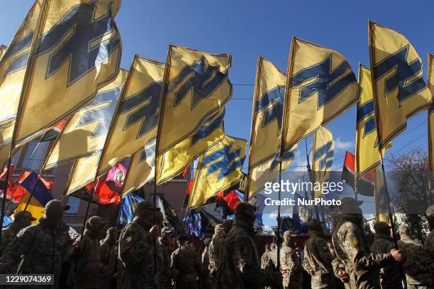 Ukrainians take part in a march to the 78th anniversary of the founding of the Ukrainian Insurgent Army in central Kyiv, Ukraine on 14 October 2020....