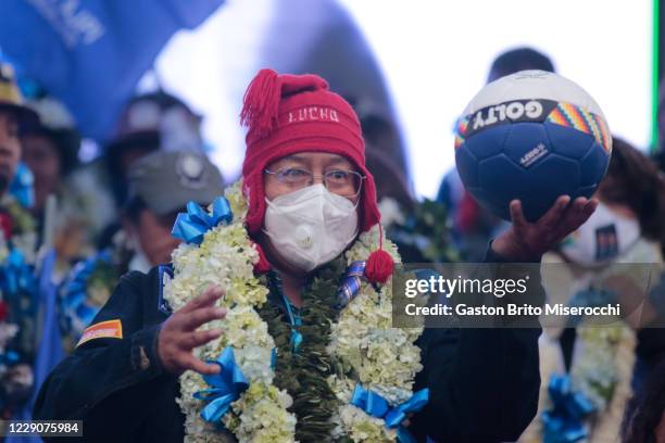 Presidential candidate of MAS Luis Arce holds a ball during his closing rally ahead of Presidential elections on October 14, 2020 in El Alto,...