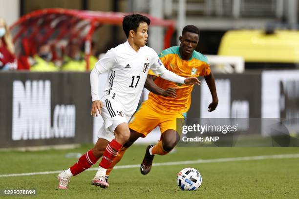 Takefusa Kubo of Japan, Odilon Kossounou or Ivory Coast during the friendly match between Japan and Ivory Coast at Stadium Galgenwaard on October 13,...