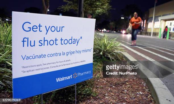 October 14, 2020 - Orlando, Florida, United States - A sign advertising flu shots is seen outside a Walmart Neighborhood Market on October 14, 2020...