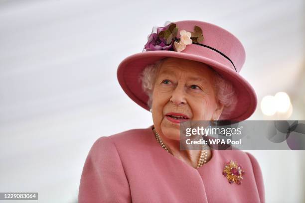Britain's Queen Elizabeth II speaks with staff during a visit to the Defence Science and Technology Laboratory at Porton Down science park on October...