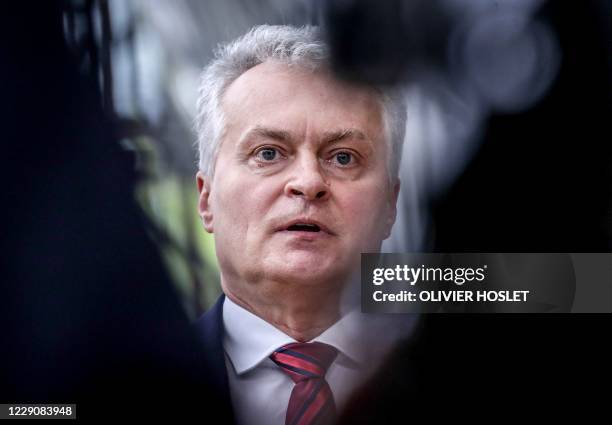 President of the Republic of Lithuania Gitanas Nauseda speaks to the press as he arrives ahead of a two days European Union summit at the European...