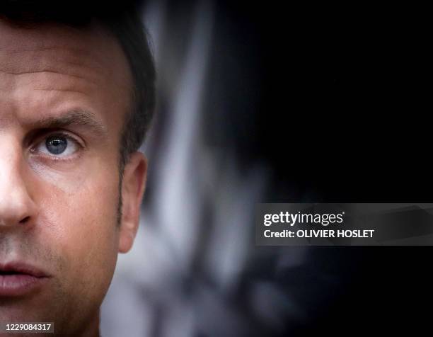 French President Emmanuel Macron, speaks to the press as he arrives ahead of a two days European Union summit at the European Council Building in...